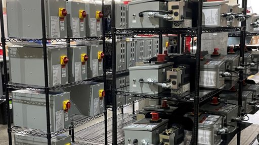 2 racks of OEM panels in a control panel manufacturing facility